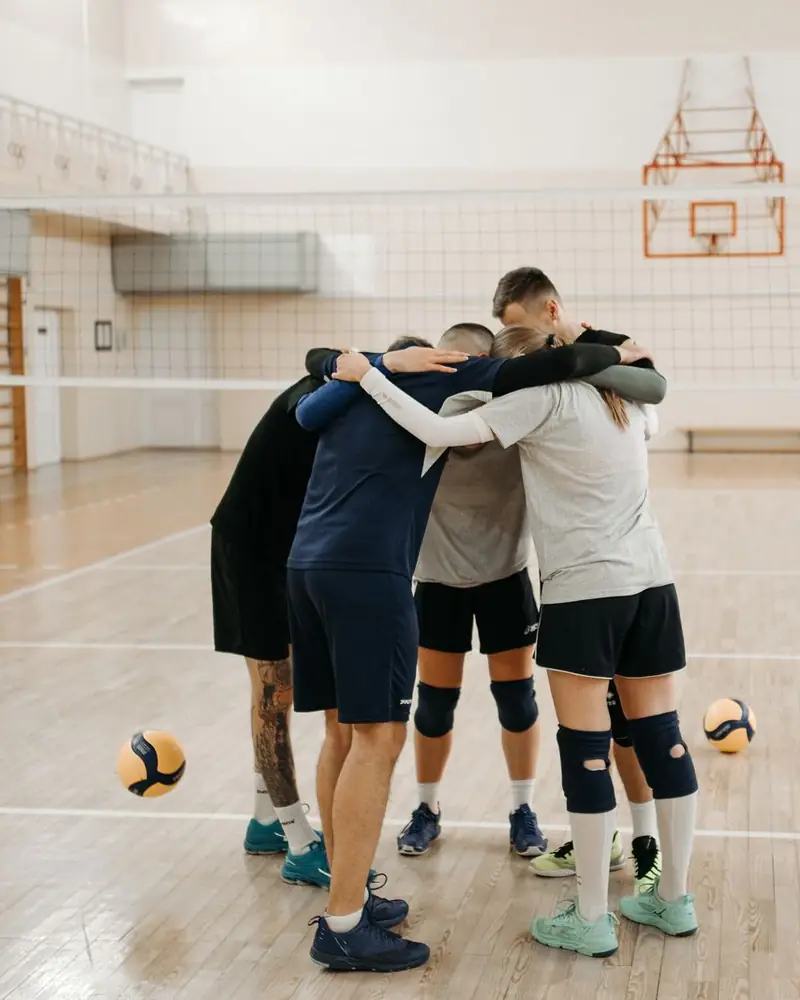 Team huddle in a sports hall